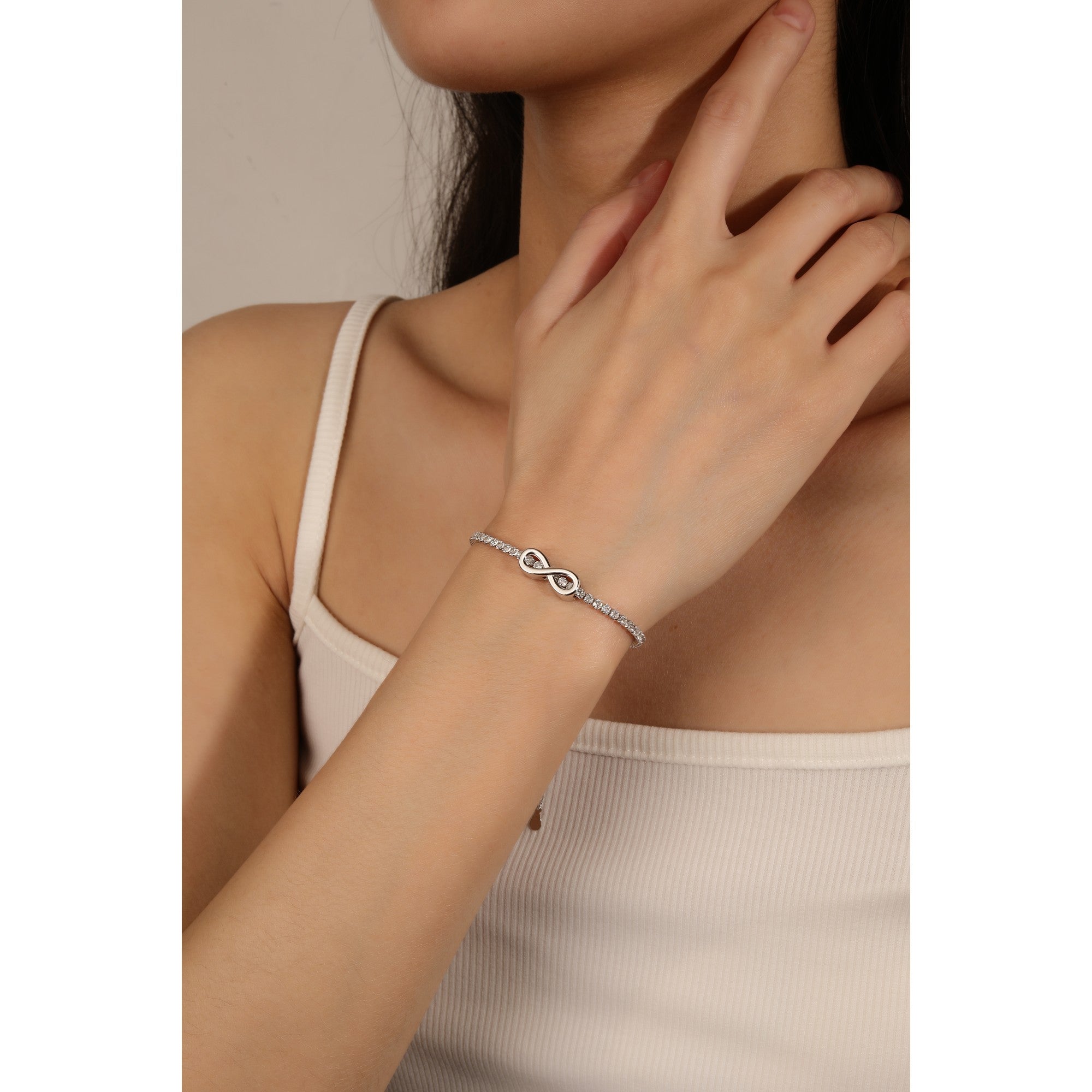 Pulsera de tenis con infinito liso y circonias blancas en rodizado